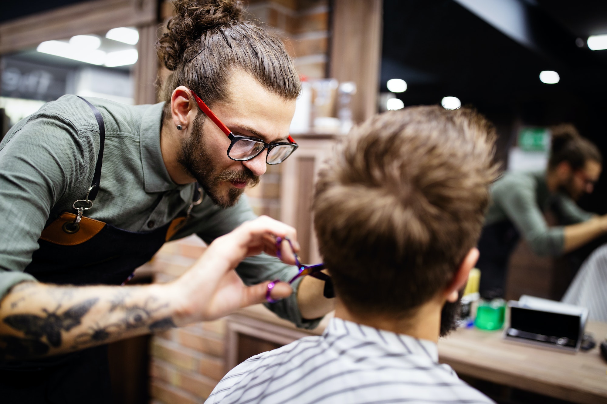 client-during-beard-and-moustache-grooming-in-barber-shop.jpg