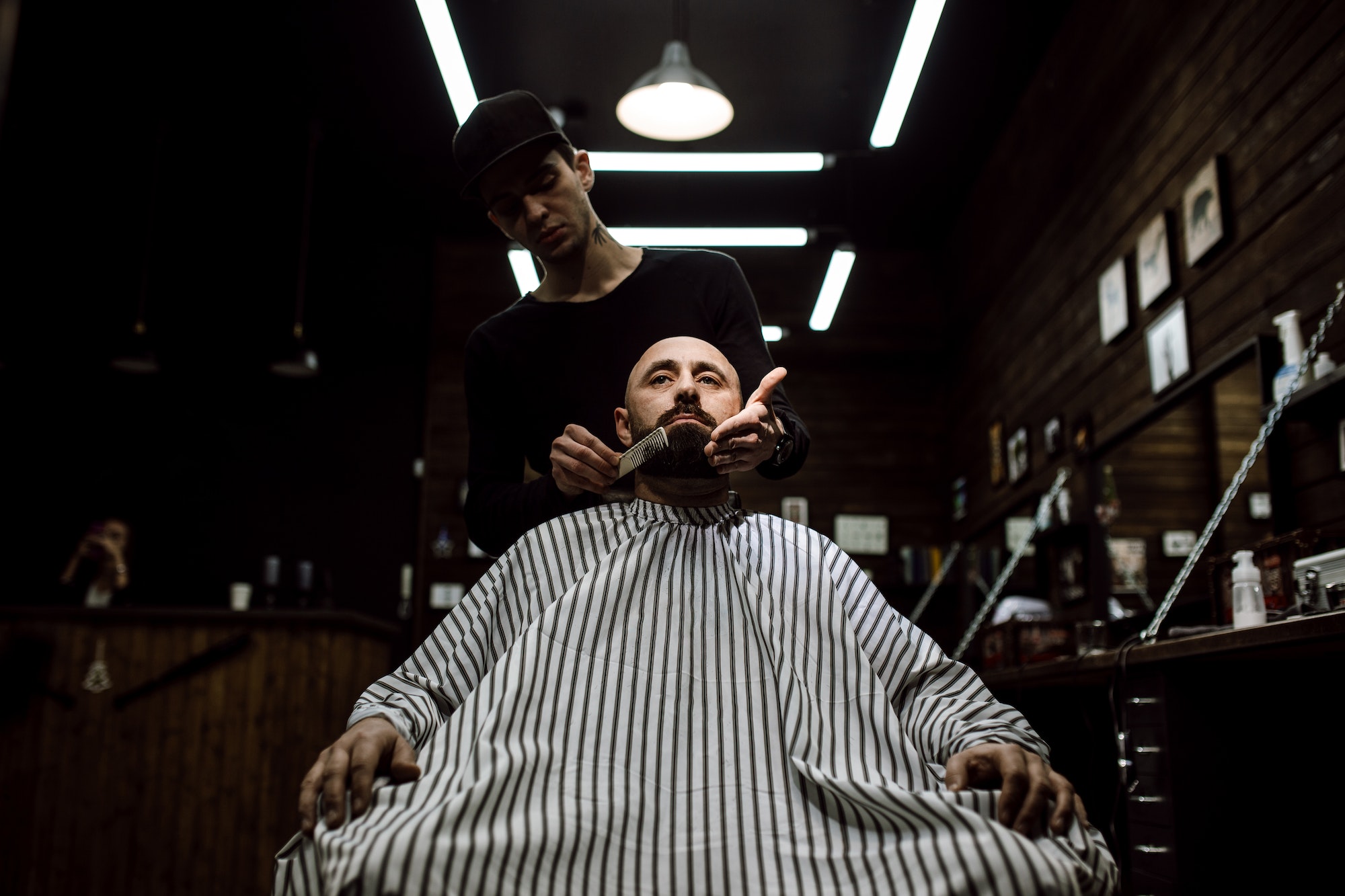 the-stylish-barbershop-the-fashion-barber-tidies-up-beard-of-brutal-man-sitting-in-the-armchair-1.jpg